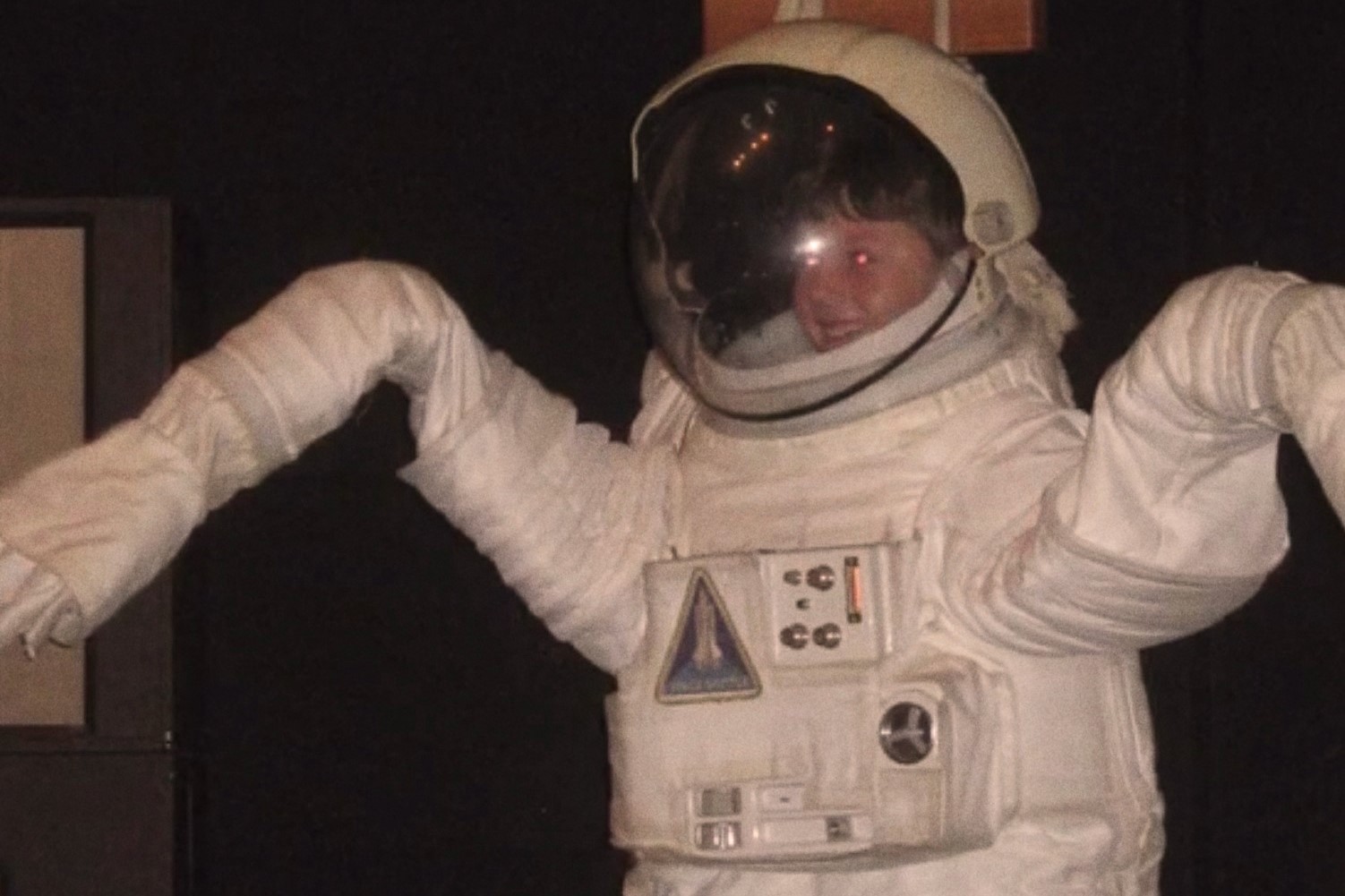 A young child in a space suit with arms raised in a silly pose for the Cherry Park EP, Volume #1